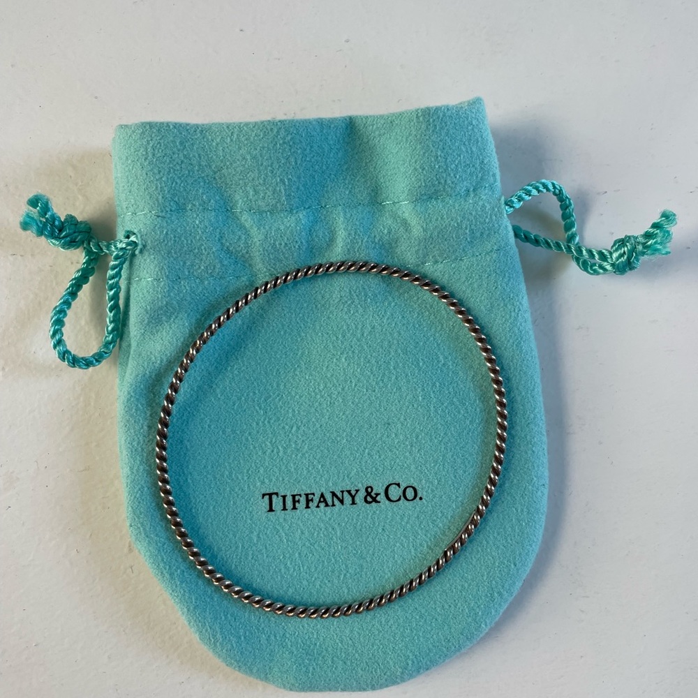 Tiffany’s sterling sliver twist bangle. In dust bag.